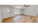 Bright living room has wood-look flooring, ceiling fan, and exterior door at 1622 Julian Oakley Rd, Rougemont, NC 27572