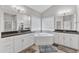 Spacious bathroom boasts dual vanities, a corner soaking tub, and a separate walk-in shower at 1811 Sandoval Dr, Durham, NC 27703