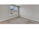 Bright bedroom features a window and neutral walls, creating a serene and inviting atmosphere at 1811 Sandoval Dr, Durham, NC 27703
