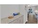 A convenient butler's pantry with countertops and cabinets with hardwood floors at 1811 Sandoval Dr, Durham, NC 27703