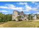 Spacious two-story home with a well-kept lawn, mature trees, and a convenient two-car garage at 1811 Sandoval Dr, Durham, NC 27703
