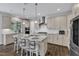 Island kitchen with a breakfast bar, pendant lighting, and stainless steel appliances at 1811 Sandoval Dr, Durham, NC 27703