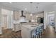 Open kitchen featuring granite countertops, stainless appliances, and bar stool seating at 1811 Sandoval Dr, Durham, NC 27703