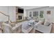 A cozy living room with a stone fireplace and comfortable seating arrangement at 1811 Sandoval Dr, Durham, NC 27703