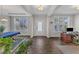 Bright living room with hardwood floors, large windows, and elegant decor at 1811 Sandoval Dr, Durham, NC 27703