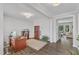 Spacious office with dark wood floors, neutral walls, and ample natural light at 1811 Sandoval Dr, Durham, NC 27703
