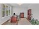 Bright home office featuring a large window, hardwood floors, and a wooden desk at 1811 Sandoval Dr, Durham, NC 27703
