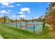 Multi-colored pickleball courts surrounded by lush landscaping and modern lighting for evening play at 1811 Sandoval Dr, Durham, NC 27703