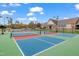 Community pickleball courts with clubhouse in view, offering a great space for recreation at 1811 Sandoval Dr, Durham, NC 27703