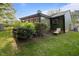 Backyard features mature trees and outdoor seating at 1820 Collier Rd, Durham, NC 27707