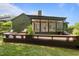 Spacious backyard with a large deck, perfect for outdoor entertaining and relaxation at 1820 Collier Rd, Durham, NC 27707
