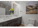 Elegant bathroom featuring dual sinks, dark wood cabinets and ample counter space at 1820 Collier Rd, Durham, NC 27707
