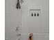 Modern bathroom with wavy tile walls, shower head, and built in shelving at 1820 Collier Rd, Durham, NC 27707