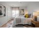 Bright bedroom with natural lighting, neutral colors, and hardwood floors at 1820 Collier Rd, Durham, NC 27707