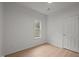 Simple bedroom with hardwood floors, white walls, and a window at 1820 Collier Rd, Durham, NC 27707
