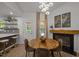 Dining room with a fireplace and adjacent kitchen at 1820 Collier Rd, Durham, NC 27707