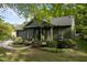 Charming home with a well-manicured front yard and an attached garage at 1820 Collier Rd, Durham, NC 27707