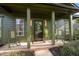 Inviting front porch with rocking chairs and stylish decor at 1820 Collier Rd, Durham, NC 27707