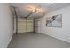Clean and spacious garage interior with ample storage and organized shelving at 1820 Collier Rd, Durham, NC 27707
