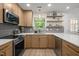 Modern kitchen featuring stainless steel appliances and soft close cabinetry at 1820 Collier Rd, Durham, NC 27707