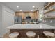 Modern kitchen featuring stainless steel appliances, quartz countertops, and bar seating at 1820 Collier Rd, Durham, NC 27707