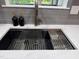 Modern kitchen sink with stylish fixtures, integrated cutting board, and sleek design at 1820 Collier Rd, Durham, NC 27707