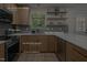 Modern kitchen featuring stainless steel appliances and quartz countertops at 1820 Collier Rd, Durham, NC 27707