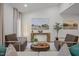 Comfortable Living room with artwork, side tables and a round coffee table at 1820 Collier Rd, Durham, NC 27707
