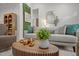 Stylish living room features a modern round wood coffee table and neutral decor at 1820 Collier Rd, Durham, NC 27707