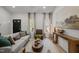 Cozy living room with ample natural light and contemporary furniture arrangement at 1820 Collier Rd, Durham, NC 27707