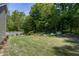 Expansive backyard with a well-manicured lawn and inviting stone patio ideal for outdoor relaxation and entertainment at 199 Telluride Trl, Garner, NC 27529