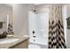 Bathroom featuring granite counters, toilet, and shower with black and white patterned curtain at 199 Telluride Trl, Garner, NC 27529