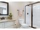 Bathroom featuring granite counters, toilet, and enclosed tiled shower with white tile surround at 199 Telluride Trl, Garner, NC 27529