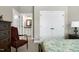 View from bedroom with patterned bedspread, looking into the bathroom and large closet at 199 Telluride Trl, Garner, NC 27529