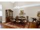 Formal dining room with an elegant chandelier, a spacious table setting, and classic decor at 199 Telluride Trl, Garner, NC 27529