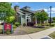 Charming exterior with a stone chimney and well-maintained landscaping, showcasing curb appeal and inviting design at 199 Telluride Trl, Garner, NC 27529