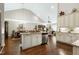 Spacious kitchen featuring an island with bar seating, stainless steel appliances, and an open floor plan at 199 Telluride Trl, Garner, NC 27529