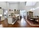 Open-concept kitchen with stainless steel appliances, a central island, and easy access to the dining and living areas at 199 Telluride Trl, Garner, NC 27529