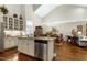 Bright kitchen with an island, stainless steel appliances, granite countertops, and an open layout at 199 Telluride Trl, Garner, NC 27529