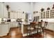 Bright kitchen featuring granite countertops, stainless steel appliances, a large island, and ample cabinet space at 199 Telluride Trl, Garner, NC 27529