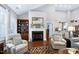 Inviting living room with a fireplace, built-in shelving, comfortable seating, and a warm ambiance at 199 Telluride Trl, Garner, NC 27529