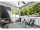 Inviting screened porch with comfortable seating, offering a relaxing space to enjoy the outdoors bug-free at 199 Telluride Trl, Garner, NC 27529
