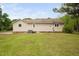 Home's exterior with light siding, green grass, AC unit, partial driveway, and blue skies at 2005 Chalybeate Springs Rd, Fuquay Varina, NC 27526