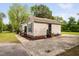Single-story home featuring a lawn with mature trees and landscaping at 2005 Chalybeate Springs Rd, Fuquay Varina, NC 27526