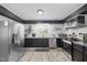 Modern kitchen featuring stainless steel appliances, granite countertops, and classic subway tile backsplash at 2005 Chalybeate Springs Rd, Fuquay Varina, NC 27526
