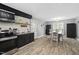 Stylish eat-in kitchen with stainless steel appliances, vinyl floors, and adjacent dining area at 2005 Chalybeate Springs Rd, Fuquay Varina, NC 27526