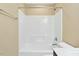Bathroom featuring shower-tub combo with white tiling at 225 Gulley Glen Dr, Garner, NC 27529