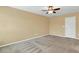 Neutral toned bedroom with ceiling fan and carpet flooring at 225 Gulley Glen Dr, Garner, NC 27529