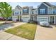 Street view of townhomes with well-manicured lawns and one-car garages at 225 Gulley Glen Dr, Garner, NC 27529