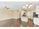 Open-concept living and kitchen area featuring hardwood floors and modern lighting at 225 Gulley Glen Dr, Garner, NC 27529